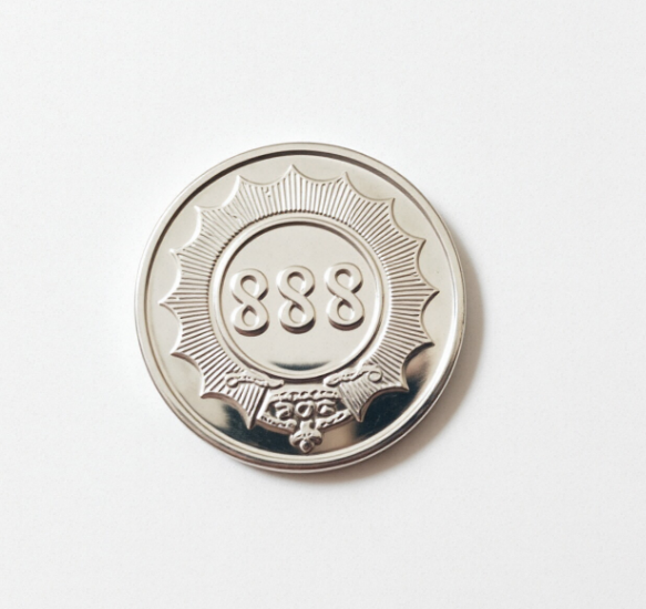 Anti-counterfeit new material token with 888 emboss